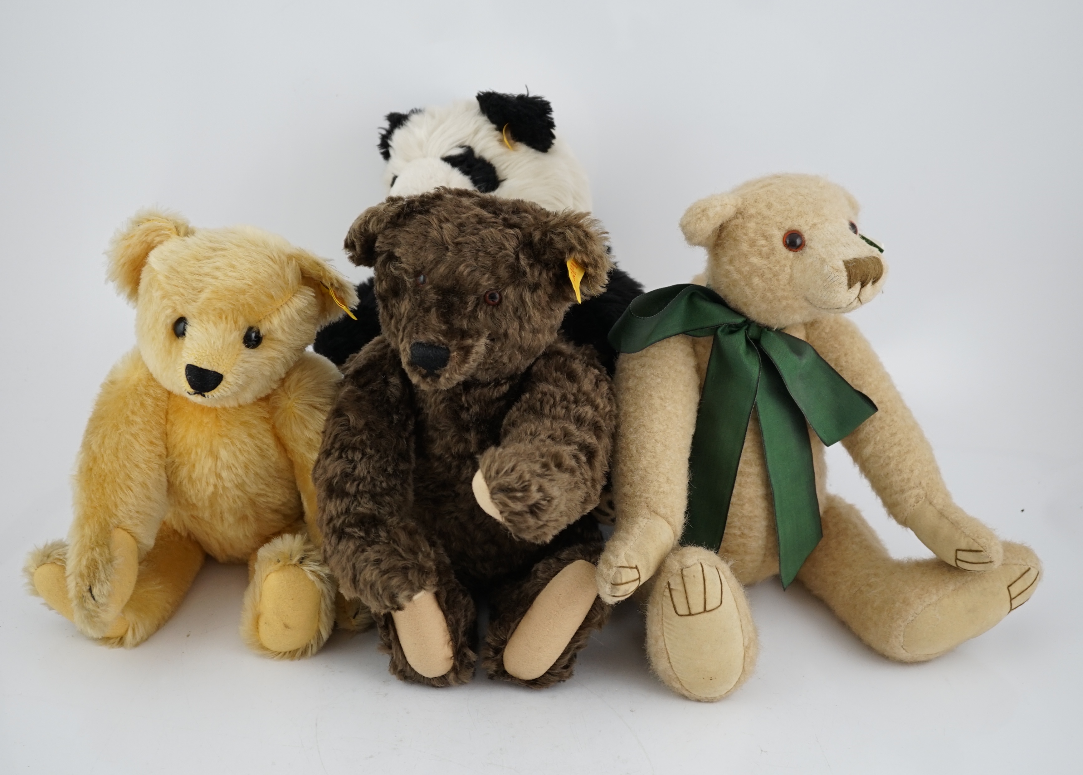 A Steiff Panda yellow tag, a Steiff bear yellow tag, an artist bear and a Steiff orange tag bear (4)